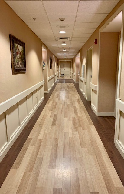 Long hallway with vinyl plank flooring