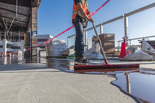 installers applying moisture control materials